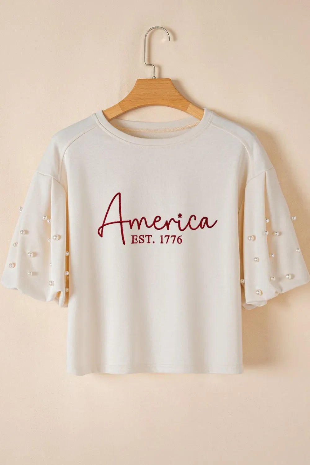 AMERICA EST 1776 Embroidered Pearl Beaded Sleeve T Shirt – White by Simply Love