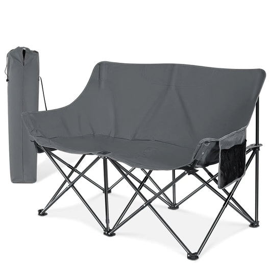 Double camping chair in grey with waterproof padded seats, steel frame, and side pockets. Folds and stores in included travel bag—ideal for outdoor activities.